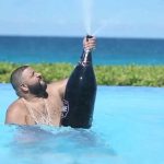 DJ Khaled pool poppin' champagne