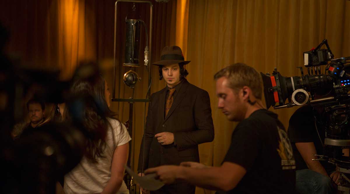 Jack White looks stylish before the cameras in a suit and tie with his trademark fedora.