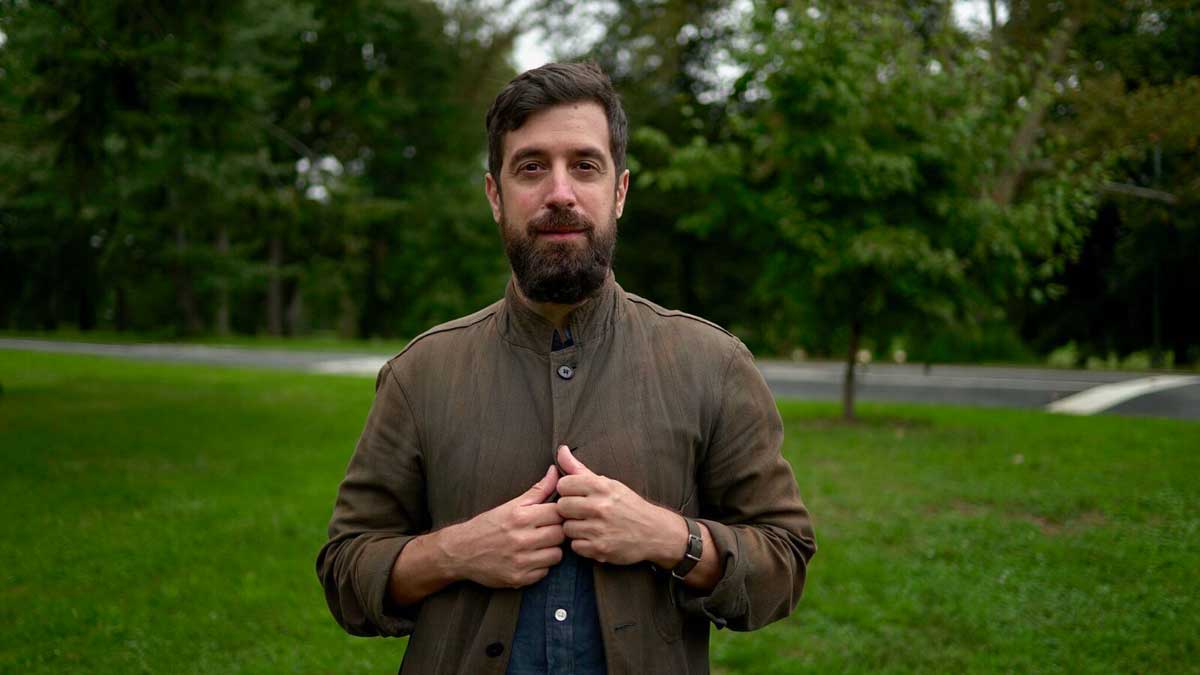 David Cieri portrait in a very lush, green park. 