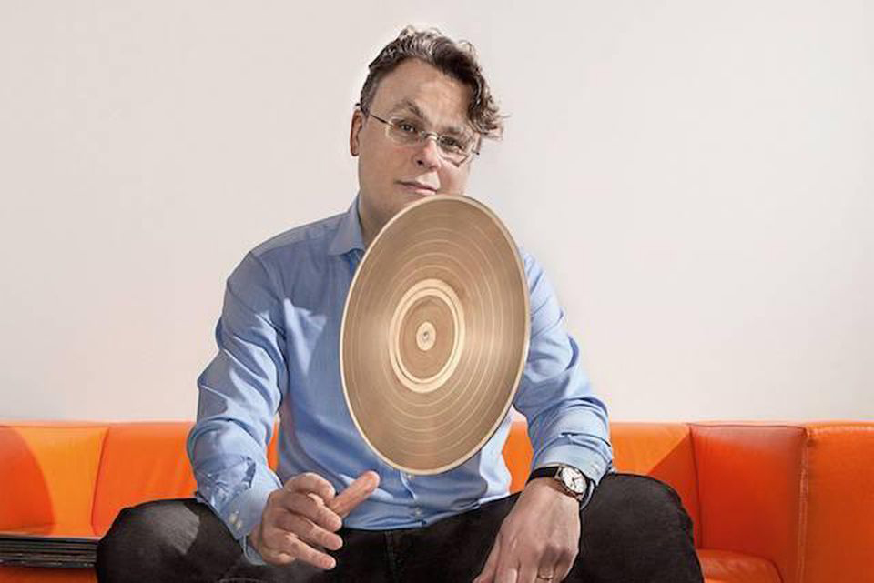 willard ahdritz photographed bouncing a gold record