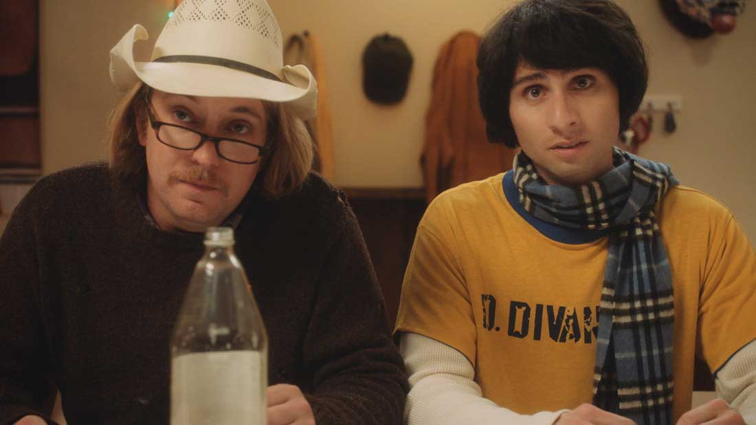 Loykasek peers up over his glasses in a cowboy hat, while Divanian looks sultry in a scarf and yellow t-shirt worn grunge-style over a long-sleeved thermal.